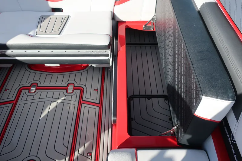 Slide: The Image of 2019 Nautique Super Air Nautique G23 interior with open storage compartment and stylish seating. - 20