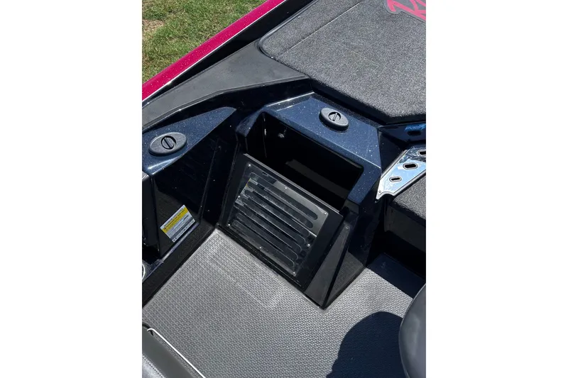 Slide: The Image of 2024 Ranger Z520R boat interior storage compartment with textured flooring and sleek design. - 20