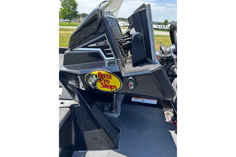 Slide: The Image of 2024 Ranger Z520R boat console with Bass Pro Shops logo, outdoors. - 37