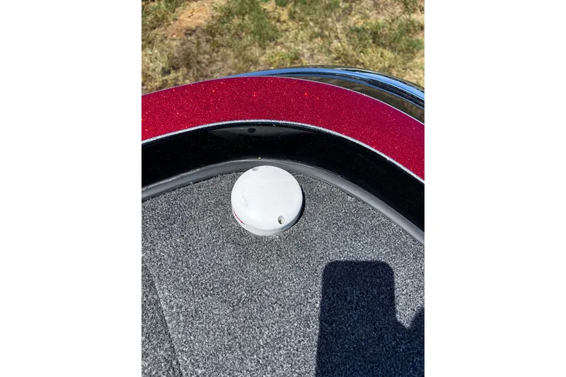 Slide: The Image of 2024 Ranger Z520R boat deck with red trim and circular fixture. - 29