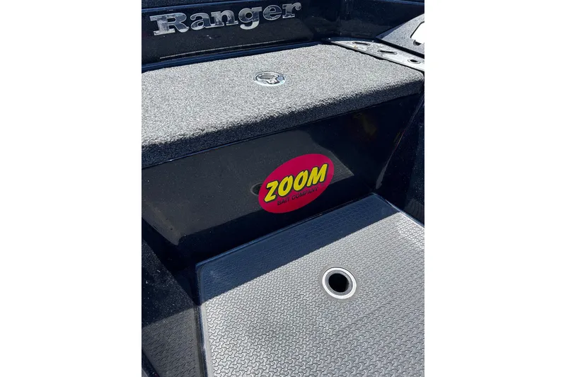 Slide: The Image of 2024 Ranger Z520R boat with Zoom Bait Company sticker on textured deck surface. - 38