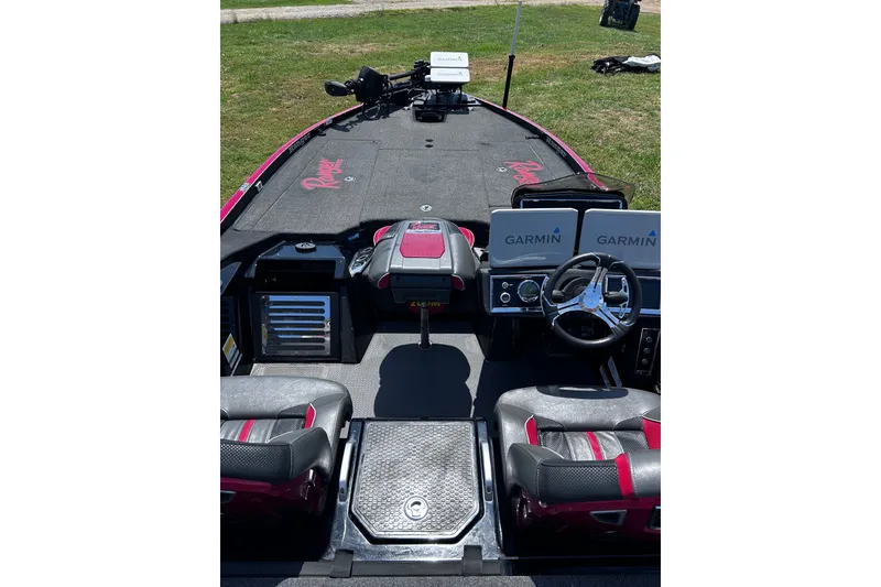 Slide: The Image of 2024 Ranger Z520R boat interior with Garmin displays and steering wheel. - 13