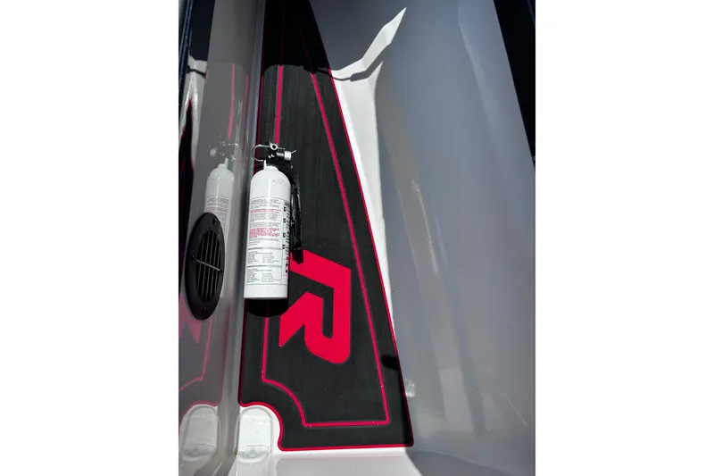 Slide: The Image of 2024 Ranger Z520R boat interior with fire extinguisher and red logo detailing. - 16