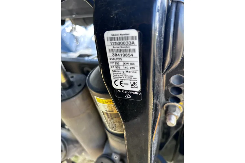 Slide: The Image of Label on 2024 Ranger Z520R boat engine, displaying model and serial numbers. - 42