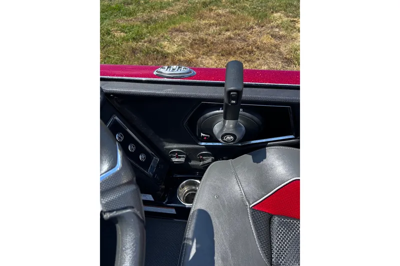 Slide: The Image of 2024 Ranger Z520R boat interior with steering wheel and control panel. - 22