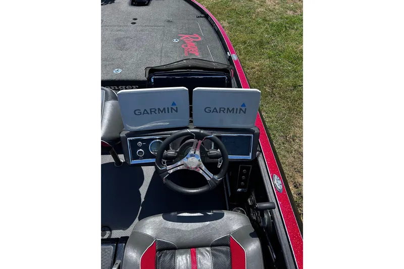Slide: The Image of 2024 Ranger Z520R boat cockpit with dual Garmin displays and steering wheel. - 21