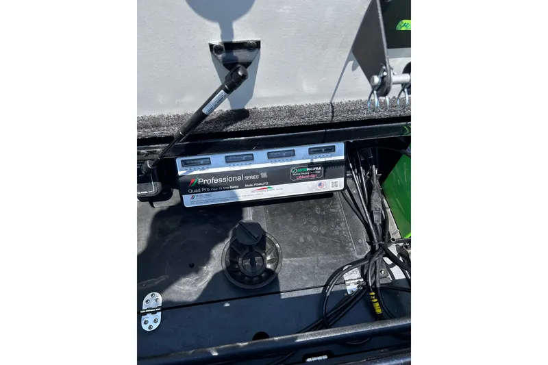 Slide: The Image of 2024 Ranger Z520R boat battery compartment with Professional Series charger. - 34
