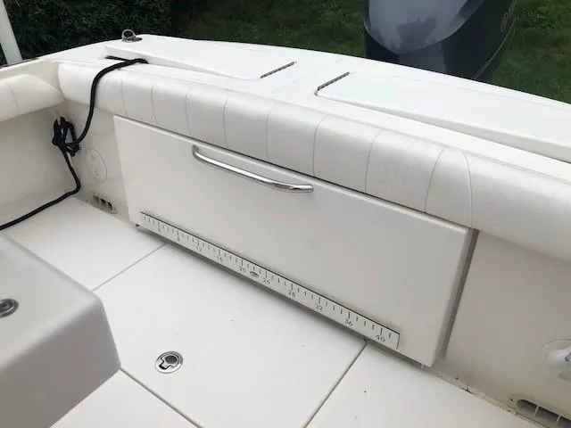 Slide: The Image of The image shows the seating area of a 2014 Regulator 23 Forward Seating boat. - 10