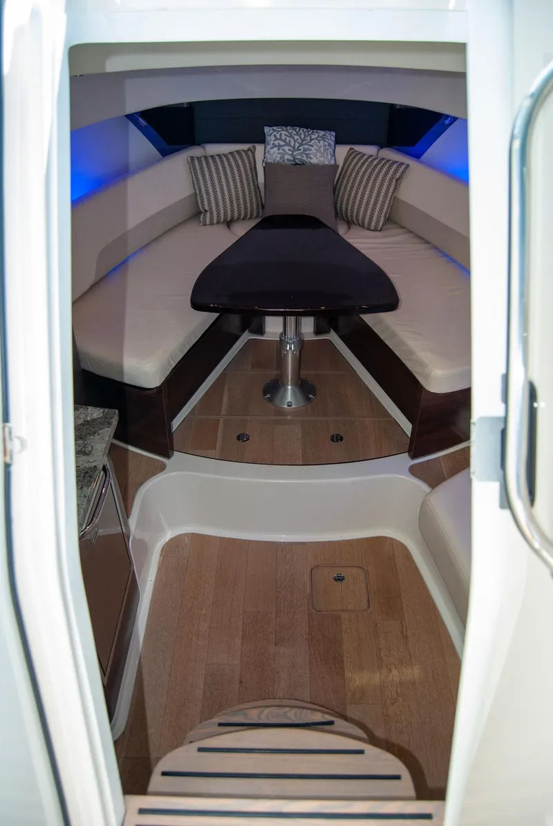 Slide: The Image of Interior of 2021 Boston Whaler 345 Conquest, featuring elegant seating and ambient lighting. - 23