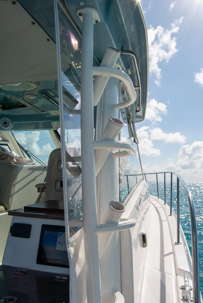 Slide: The Image of 2021 Boston Whaler 345 Conquest boat on open sea under clear sky. - 43