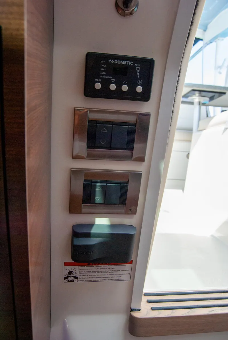 Slide: The Image of Control panel on a 2021 Boston Whaler 345 Conquest boat interior. - 37