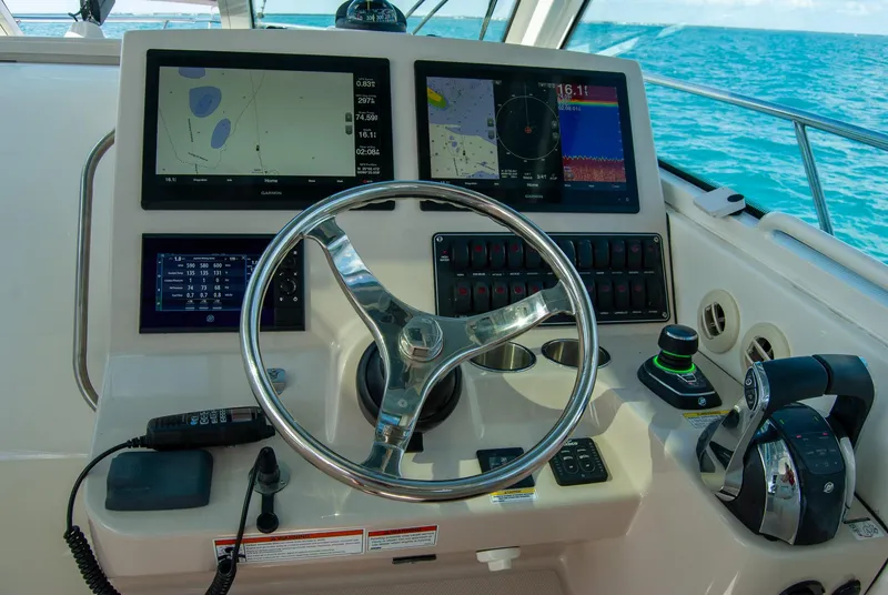 Slide: The Image of Helm of 2021 Boston Whaler 345 Conquest with navigation screens and controls. - 9