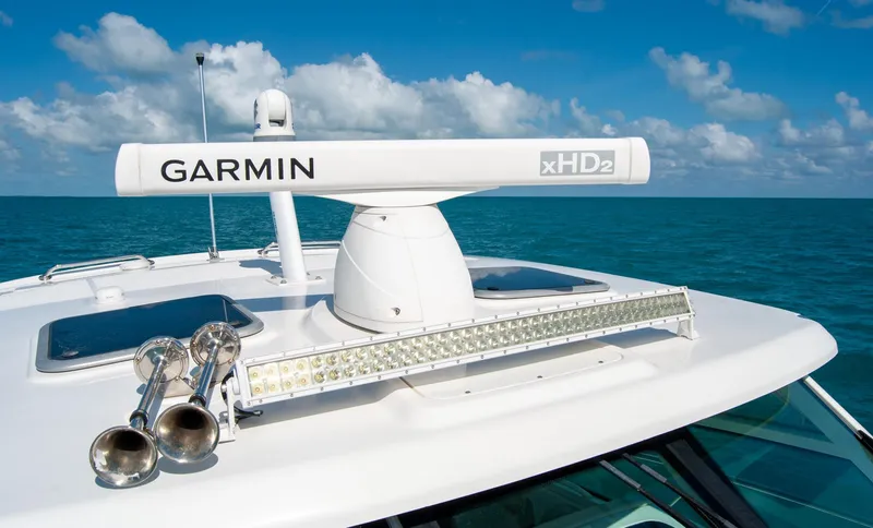 Slide: The Image of 2021 Boston Whaler 345 Conquest with Garmin radar on open sea under blue sky. - 42