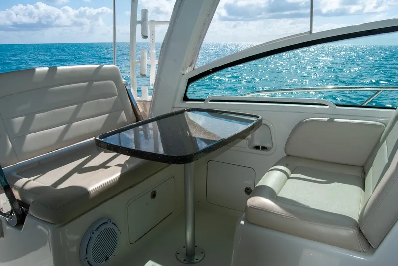 Slide: The Image of Interior of 2021 Boston Whaler 345 Conquest with ocean view and seating area. - 10