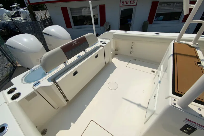 Slide: The Image of 2018 Cobia 301 Center Console boat interior with seating and storage compartments. - 15