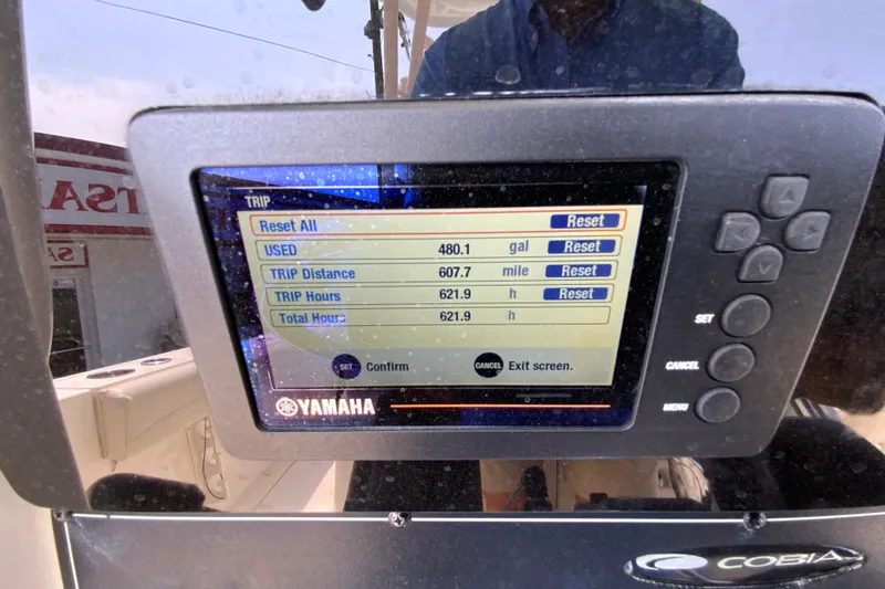 Slide: The Image of Yamaha display on 2018 Cobia 301 Center Console showing trip data and fuel usage. - 14