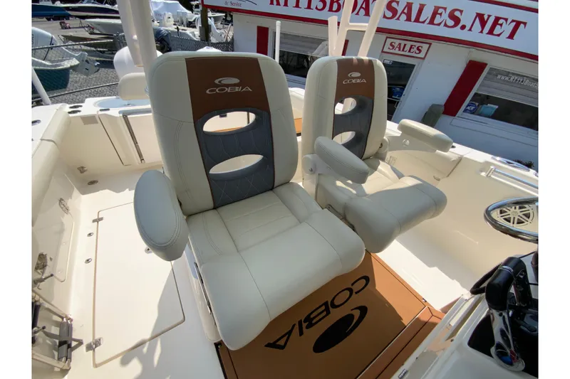 Slide: The Image of 2018 Cobia 301 Center Console boat seats with armrests, showcasing luxury and comfort. - 30