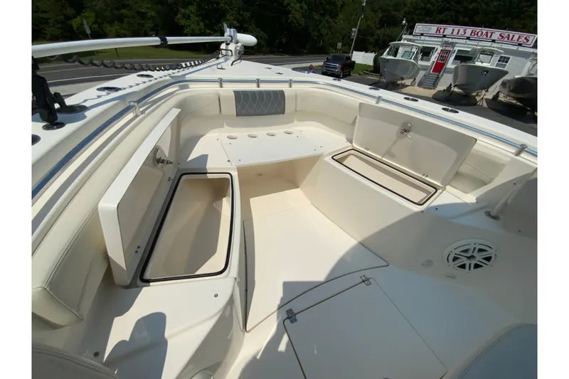 Slide: The Image of 2018 Cobia 301 Center Console boat interior with open storage compartments. - 20