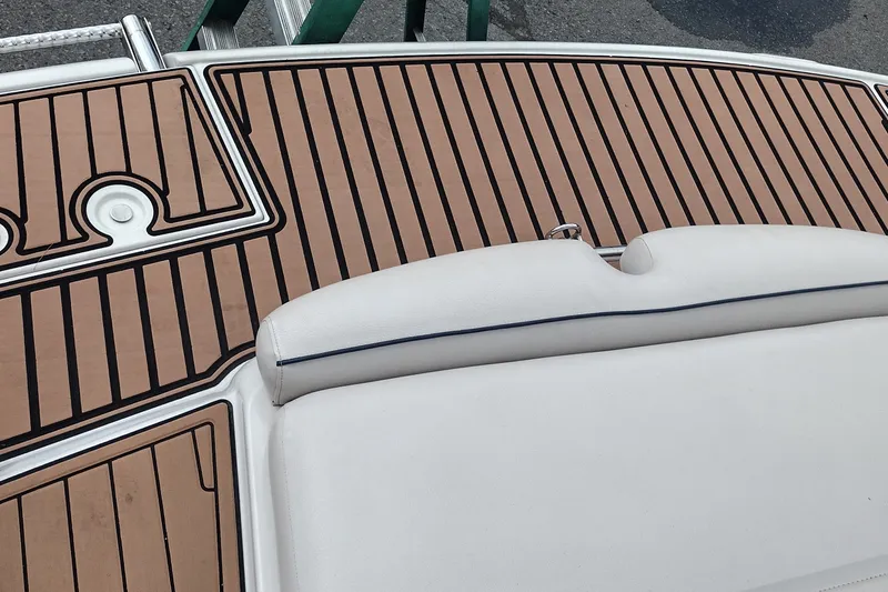 Slide: The Image of 2013 Crownline Eclipse E4 boat deck with cushioned seating and teak-style flooring. - 44