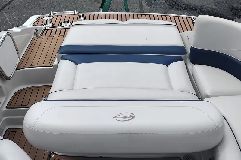 Slide: The Image of 2013 Crownline Eclipse E4 boat interior with white and blue cushioned seating. - 38