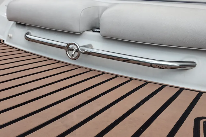 Slide: The Image of 2013 Crownline Eclipse E4 boat with teak deck and chrome railing detail. - 45