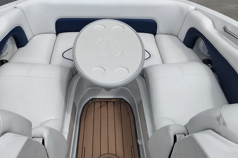Slide: The Image of 2013 Crownline Eclipse E4 boat interior with white seating and a central table. - 30