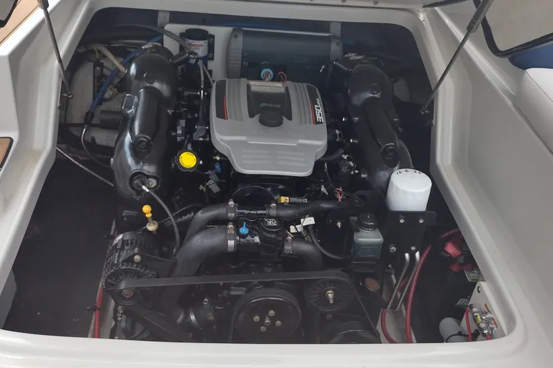 Slide: The Image of Engine compartment of a 2013 Crownline Eclipse E4 boat, showcasing detailed components. - 25