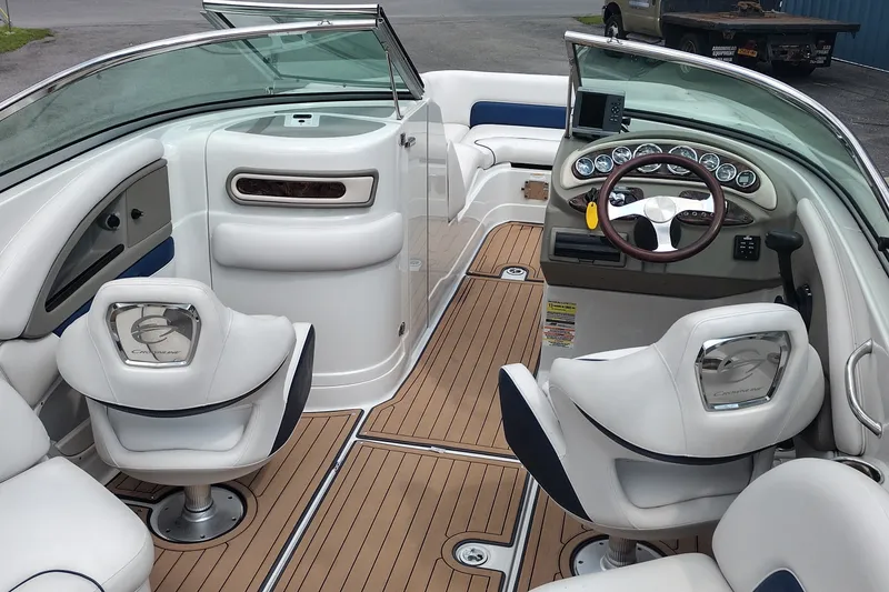 Slide: The Image of 2013 Crownline Eclipse E4 boat interior with luxurious seating and modern dashboard. - 10