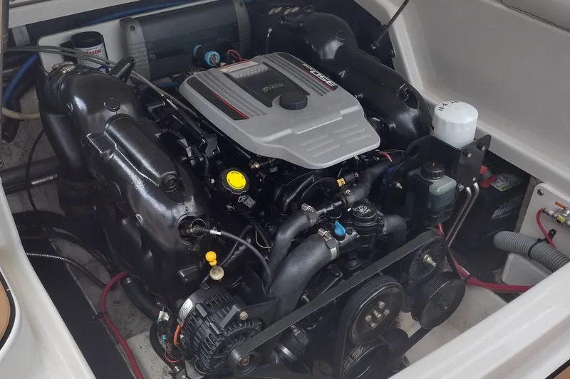 Slide: The Image of Engine compartment of a 2013 Crownline Eclipse E4 boat, showcasing detailed components. - 27