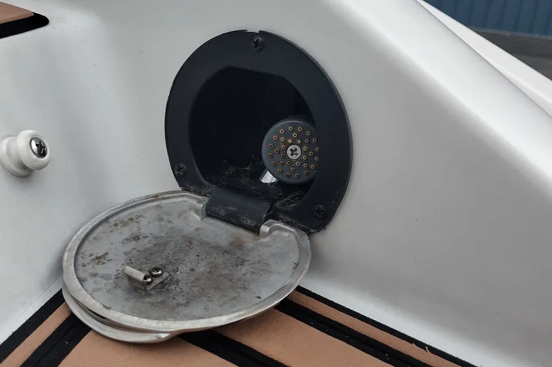 Slide: The Image of 2013 Crownline Eclipse E4 boat fuel cap and connector detail. - 46