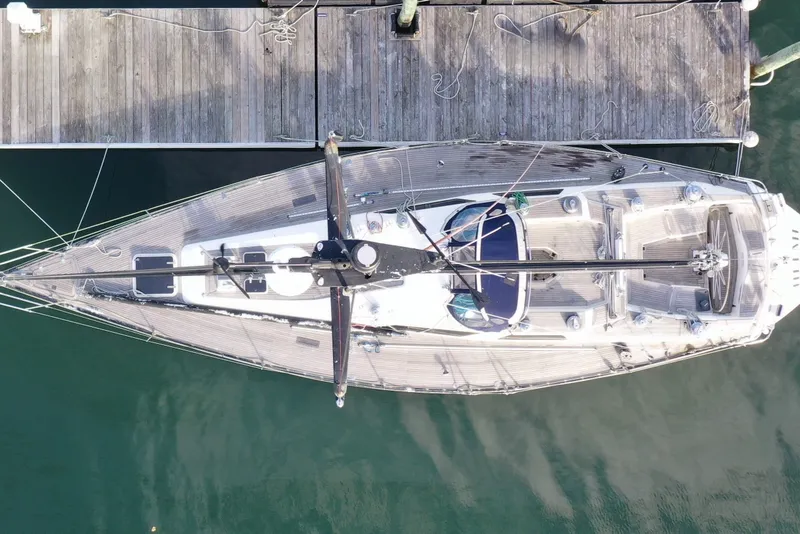 Slide: The Image of Overhead view of 1986 Baltic 48 DP yacht docked at a wooden pier. - 15