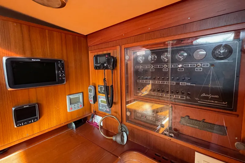 Slide: The Image of Control panel of a 1986 Baltic 48 DP yacht with navigation and communication equipment. - 19