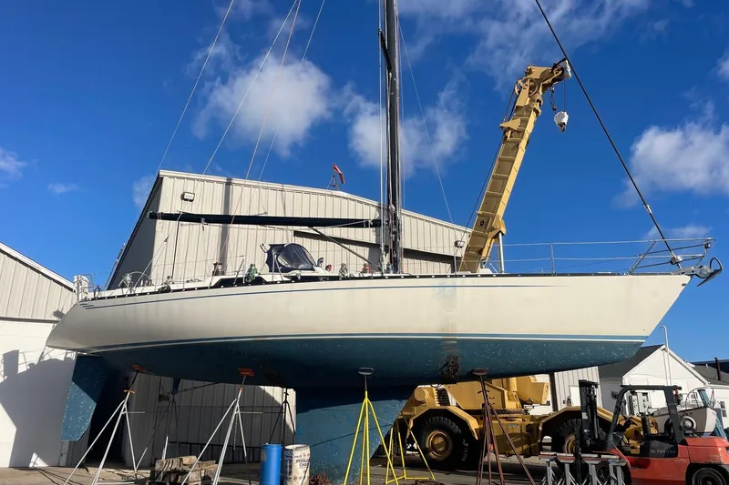 Slide: The Image of Sailboat Baltic 48 DP 1986 on dry dock with crane and clear sky background. - 32