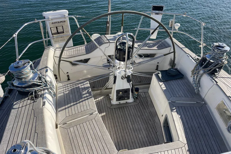 Slide: The Image of Cockpit of a 1986 Baltic 48 DP sailboat with steering wheel and winches. - 8