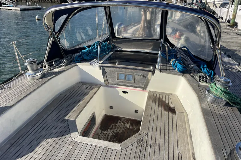 Slide: The Image of Cockpit of 1986 Baltic 48 DP sailboat with ropes and winches, docked at marina. - 9