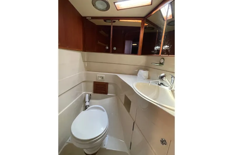 Slide: The Image of Bathroom interior of 1986 Baltic 48 DP yacht, featuring sink and toilet. - 28