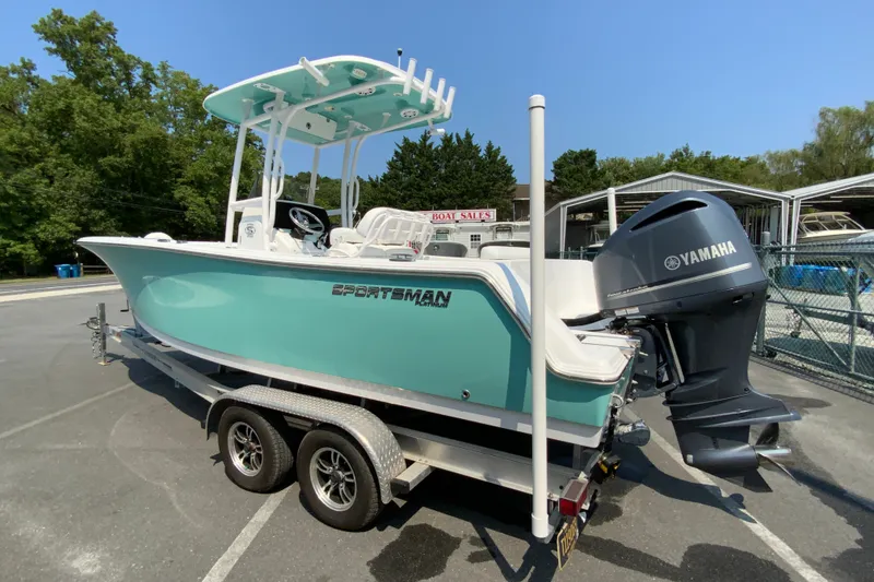 Slide: The Image of 2023 Sportsman Open 232 Center Console boat on trailer with Yamaha engine. - 7