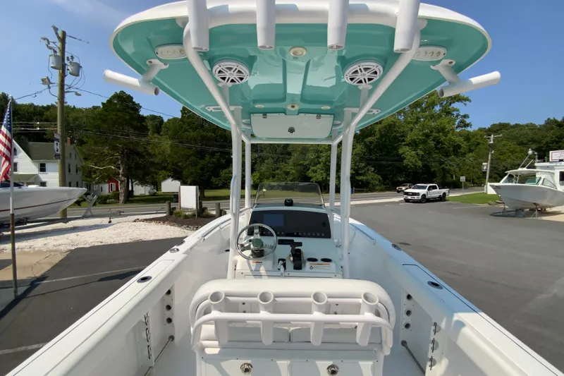 Slide: The Image of 2023 Sportsman Open 232 Center Console boat with T-top and modern dashboard. - 11