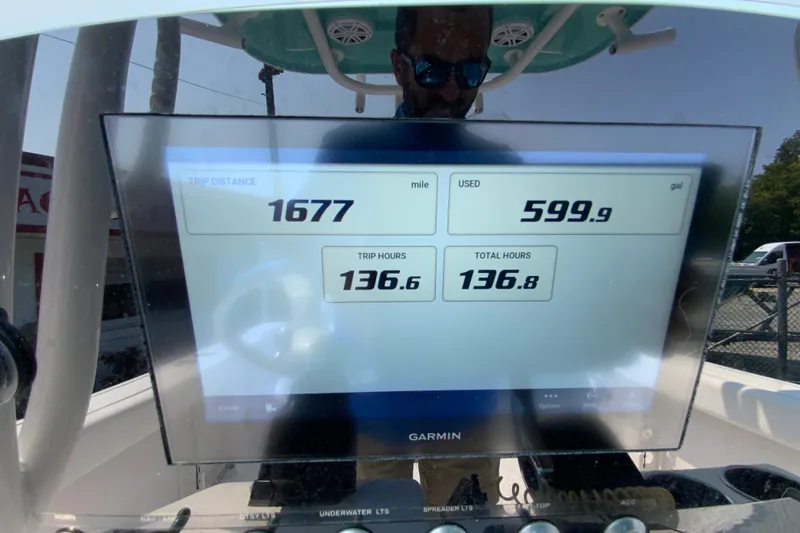 Slide: The Image of Display screen on 2023 Sportsman Open 232 Center Console showing trip data and fuel usage. - 14