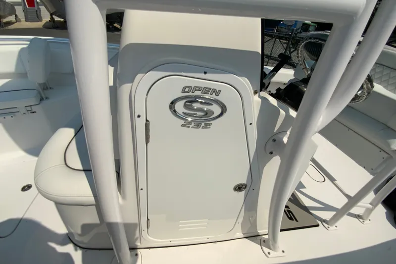 Slide: The Image of 2023 Sportsman Open 232 Center Console boat interior with storage compartment. - 27