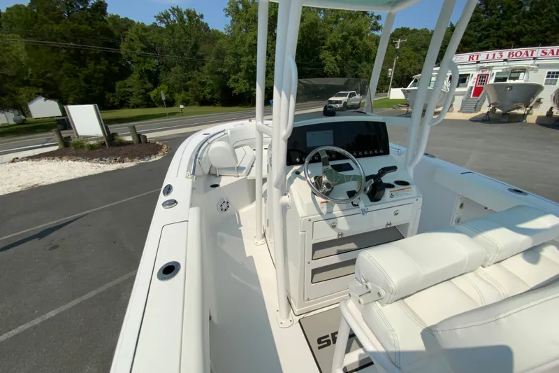 Slide: The Image of 2023 Sportsman Open 232 Center Console boat with modern helm and seating. - 19