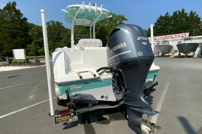 Slide: The Image of 2023 Sportsman Open 232 Center Console boat with Yamaha 250 engine, parked outdoors. - 8