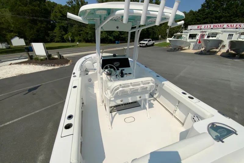 Slide: The Image of 2023 Sportsman Open 232 Center Console boat at dealership, showcasing spacious interior and modern design. - 10