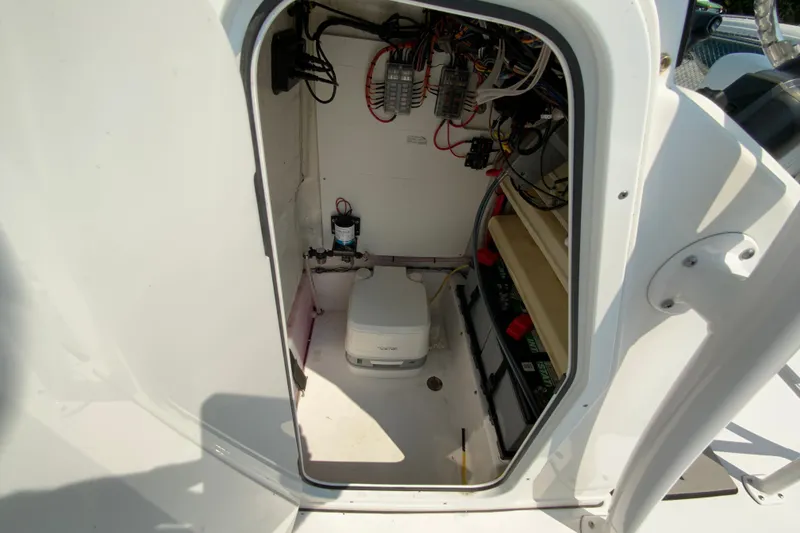 Slide: The Image of 2023 Sportsman Open 232 Center Console interior wiring and equipment compartment. - 28