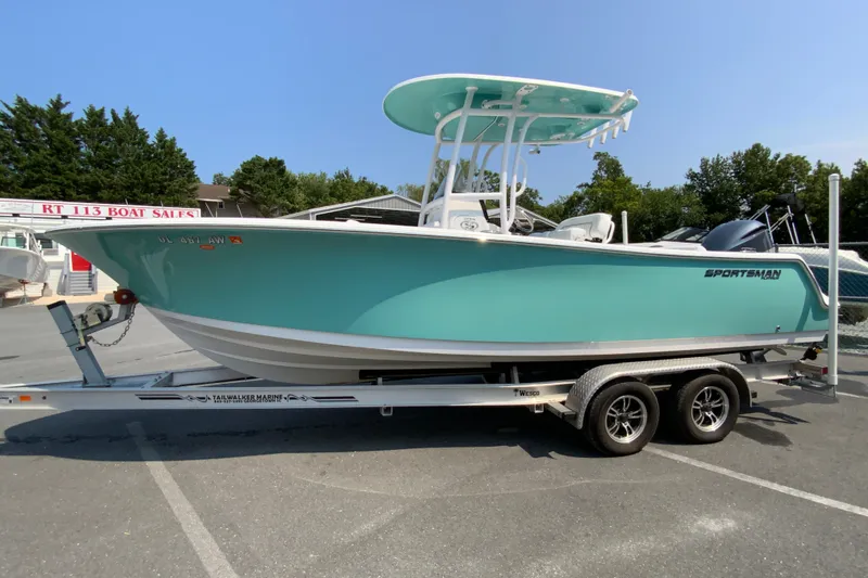 Slide: The Image of 2023 Sportsman Open 232 Center Console boat on trailer at dealership. - 6