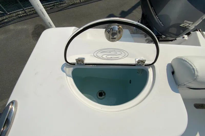 Slide: The Image of 2023 Sportsman Open 232 Center Console livewell with open lid, showcasing interior. - 18
