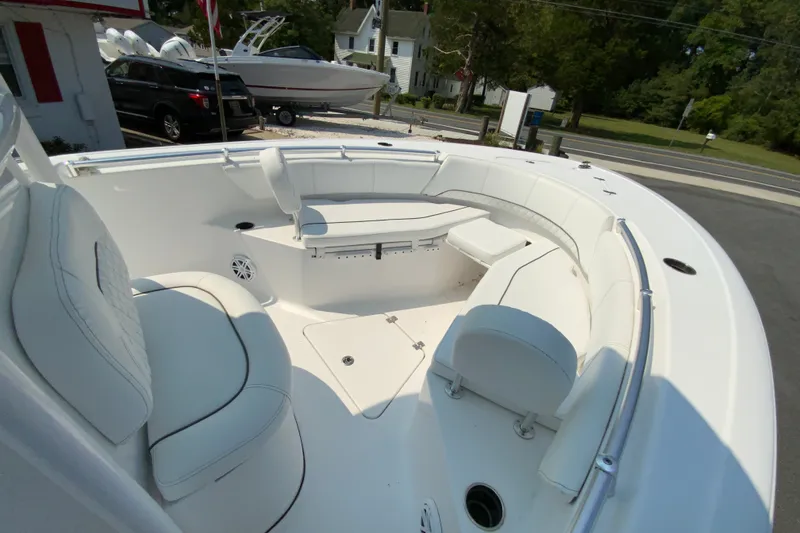 Slide: The Image of 2023 Sportsman Open 232 Center Console boat with spacious seating and sleek design. - 24