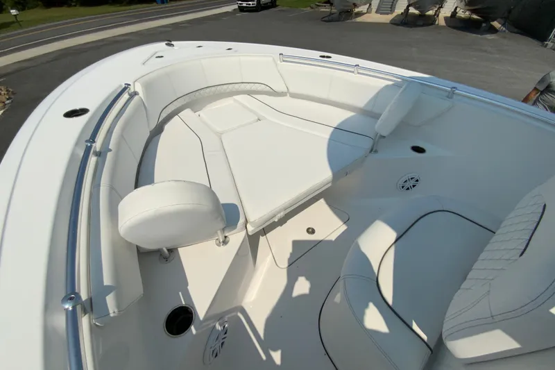 Slide: The Image of 2023 Sportsman Open 232 Center Console boat interior with white seating and modern design. - 21