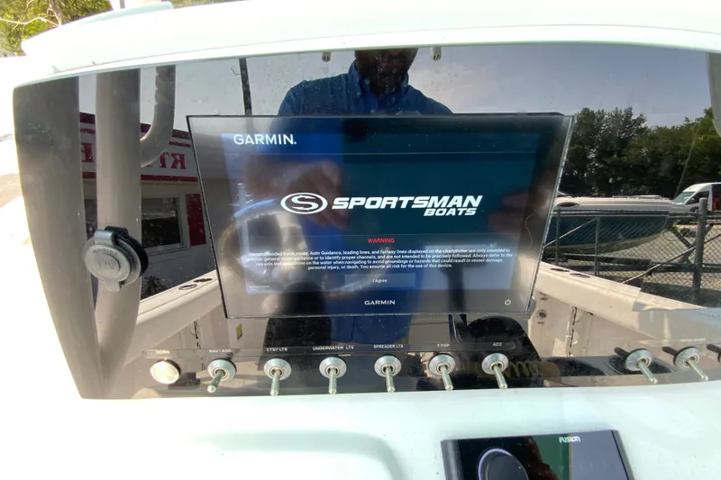 Slide: The Image of Garmin display on 2023 Sportsman Open 232 Center Console boat dashboard. - 13