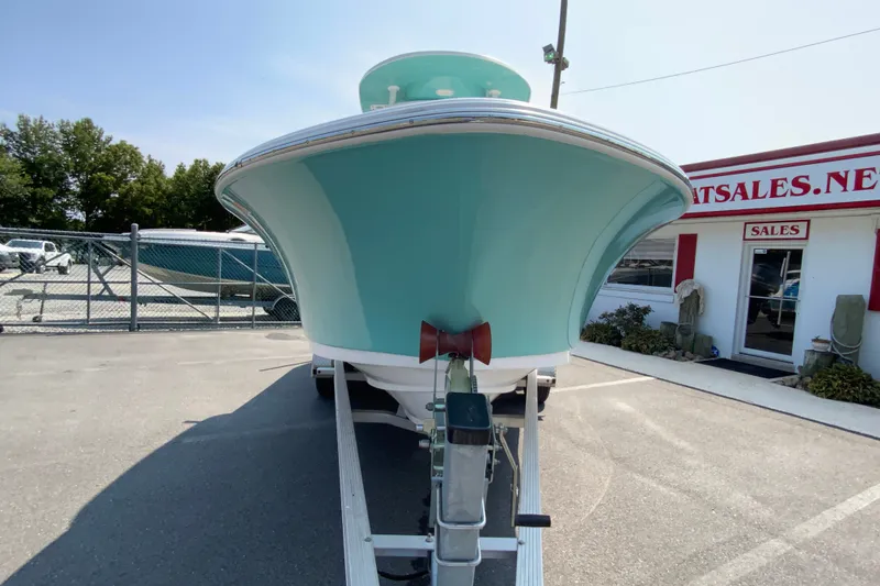 Slide: The Image of 2023 Sportsman Open 232 Center Console boat on trailer at dealership. - 4